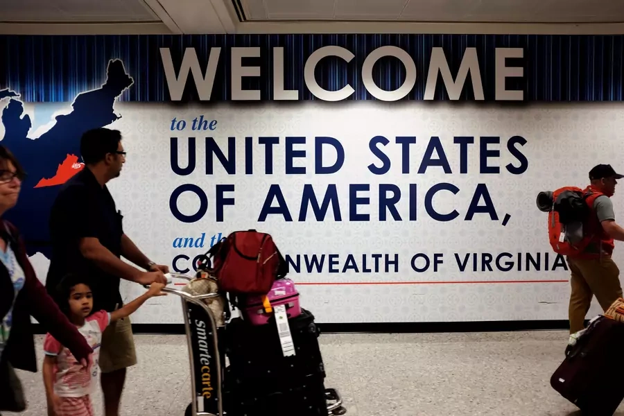 A family exits after clearing immigration and customs at Dulles International Airport in Dulles, Virginia, United States, on September 24, 2017. James Lawler Duggan/Reuters